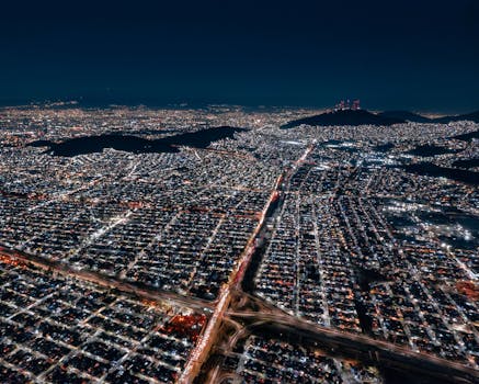 Three entrepreneurs meeting and shaking hands in a modern office setting.