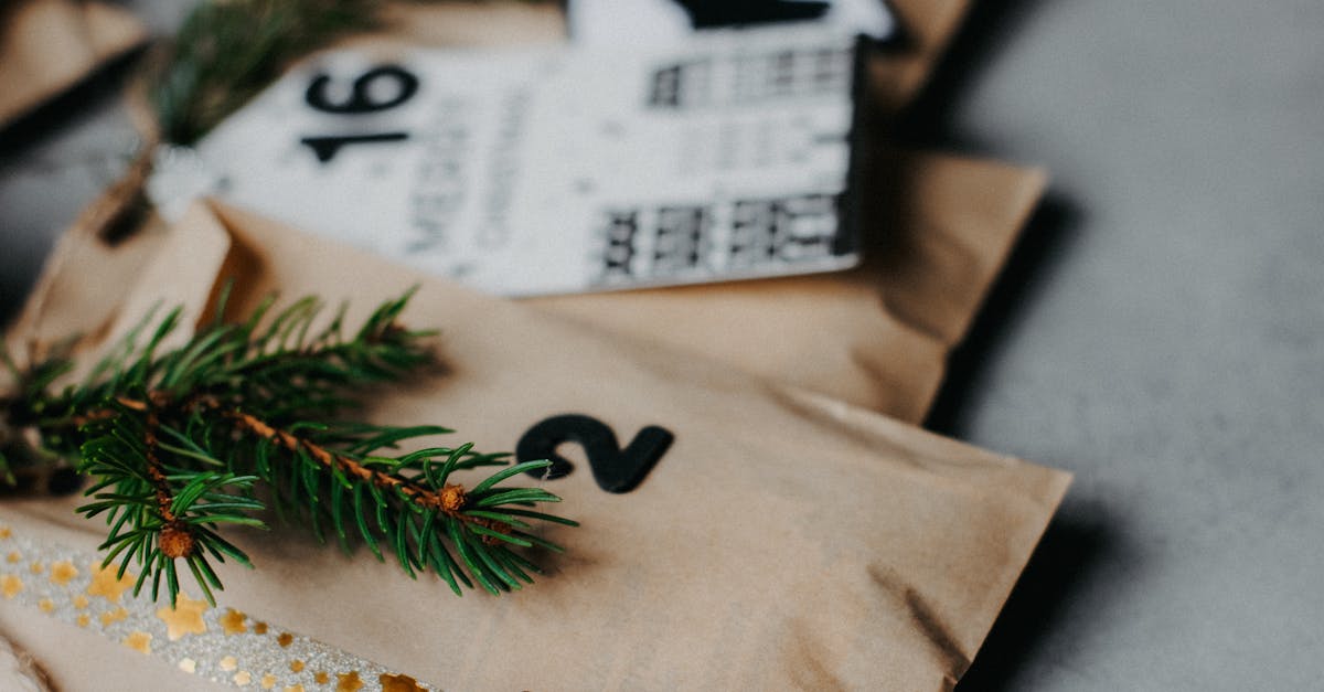 Close-up of a decorated advent calendar with evergreen sprigs for a festive touch.