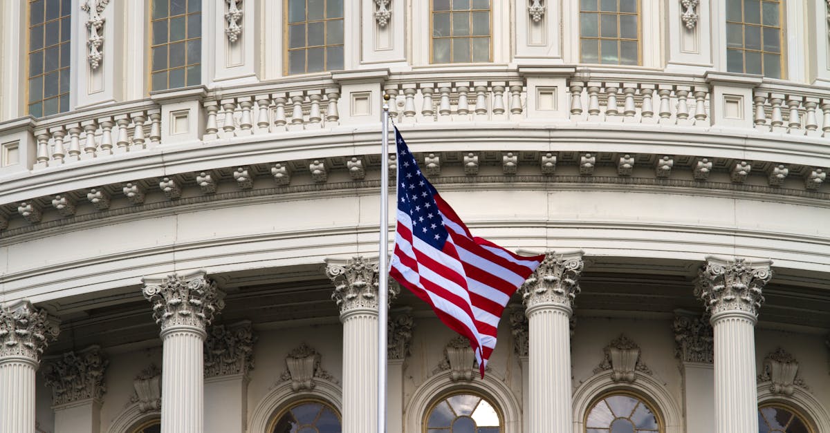 Close-up of the American flag waving outside the United States Capitol in Washington, DC.