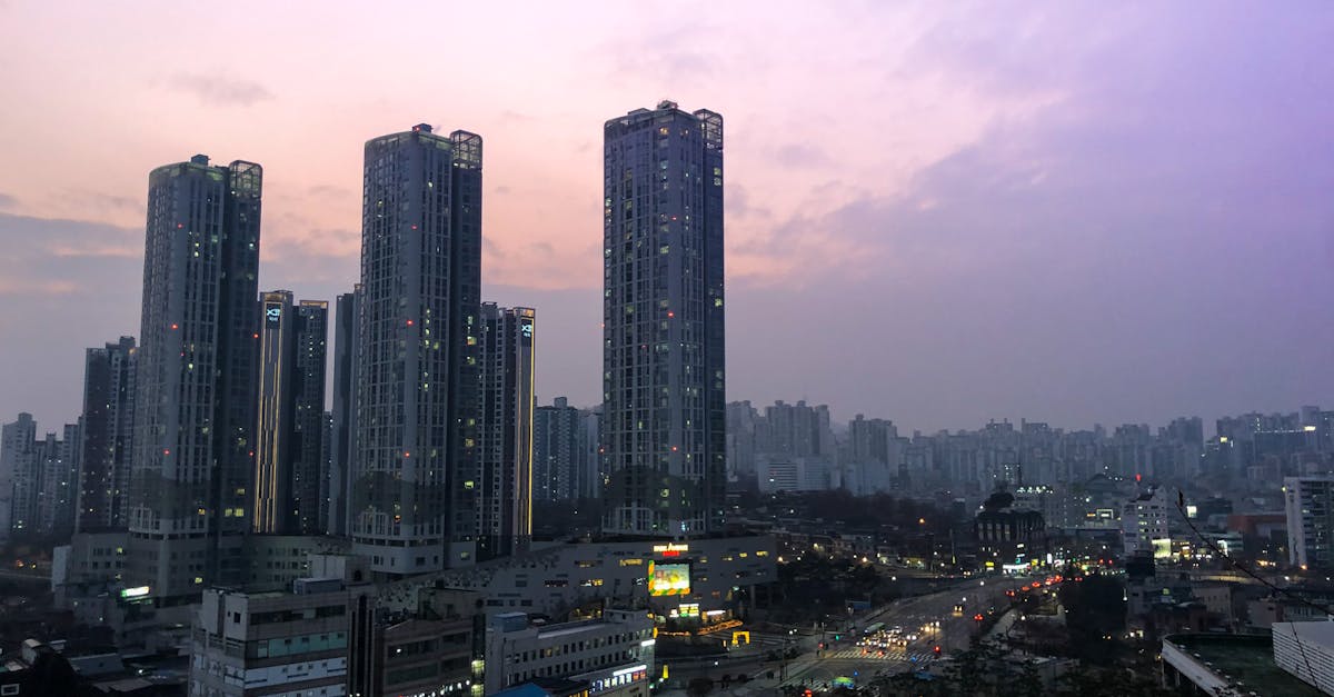 A mesmerizing view of towering skyscrapers in South Korea at dusk, under a purple sky.