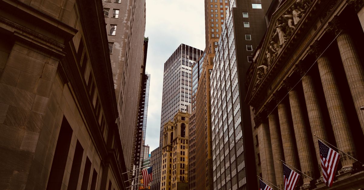 A captivating view of New York City's Wall Street, showcasing iconic architecture and urban density.
