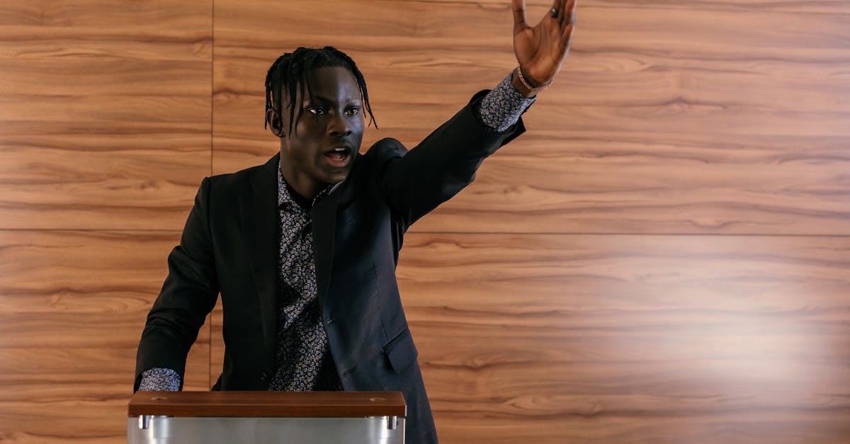 A passionate politician delivering a speech at a podium indoors.