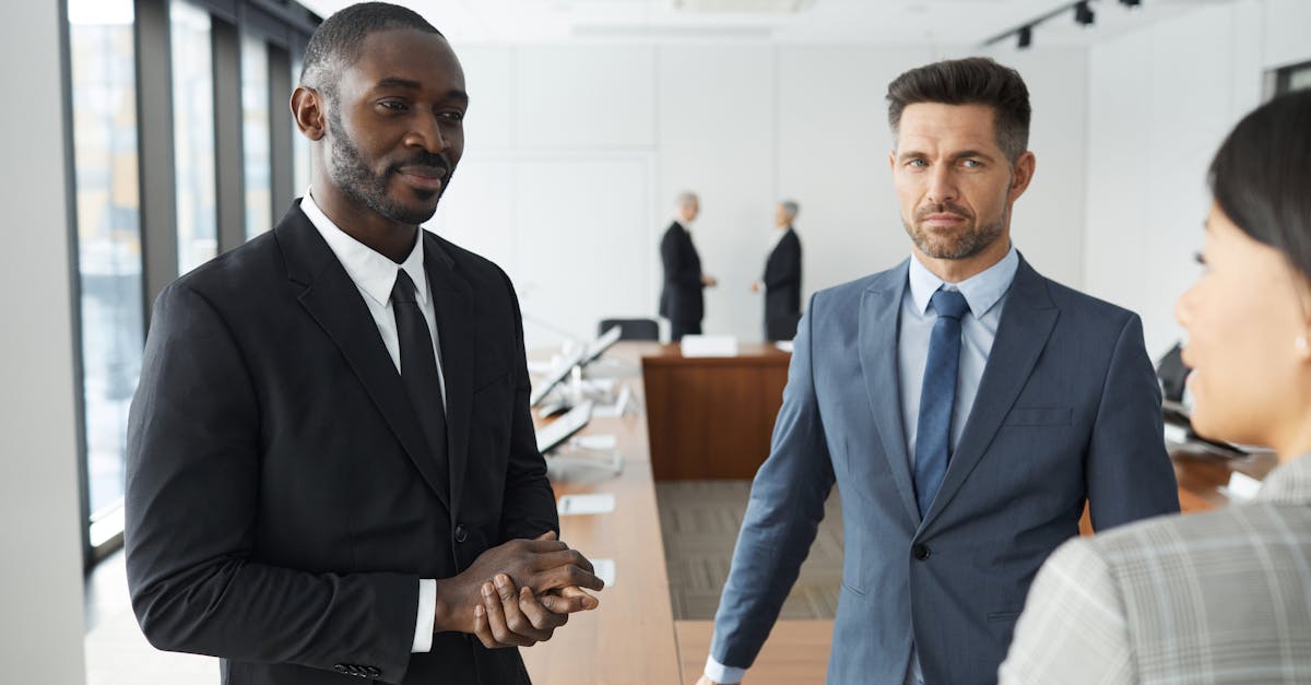 A diverse group of professionals engaged in a business meeting in a modern conference room.