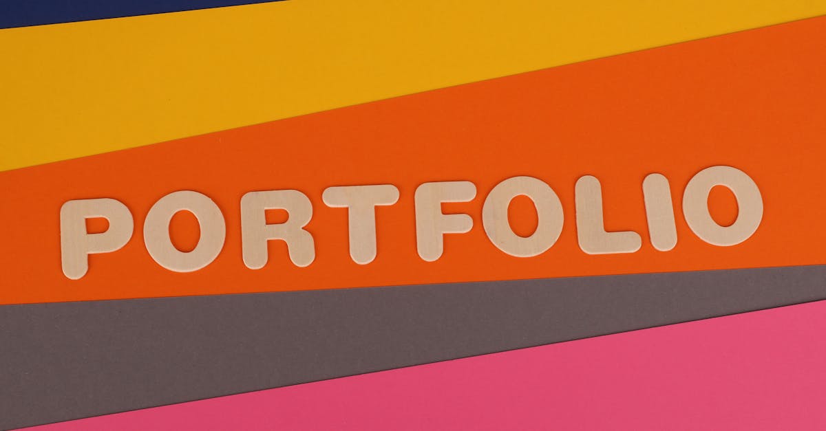 A vibrant multicolored background featuring the text 'PORTFOLIO' in pink font on colorful paper.