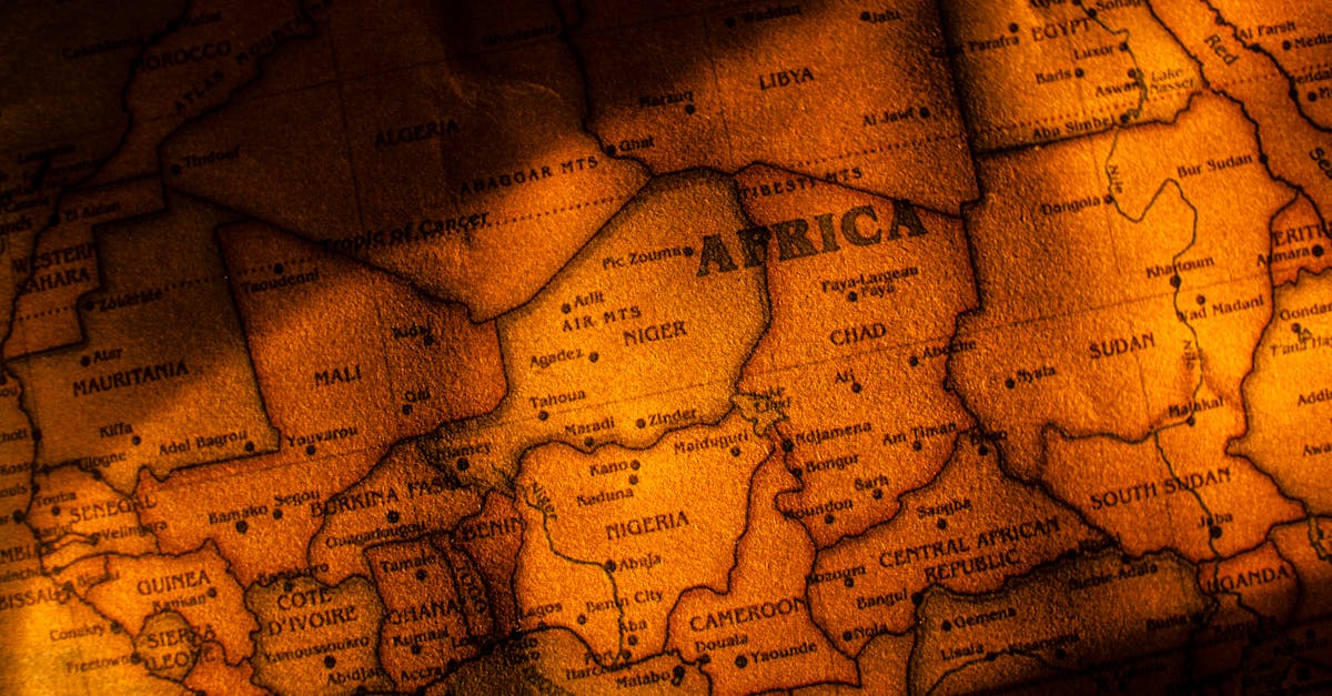 Close-up photograph of a vintage styled map highlighting Africa with brown sepia tones.