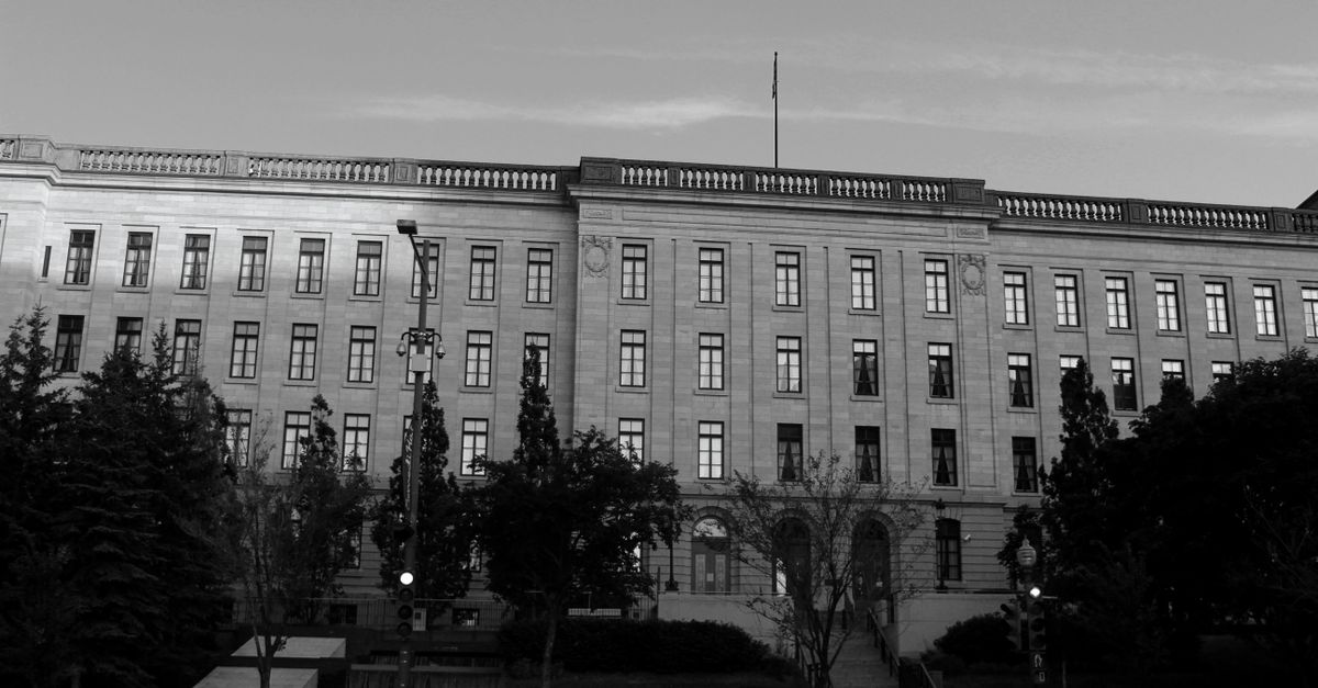 Monochrome image of a historic building's facade showcasing architectural elegance.