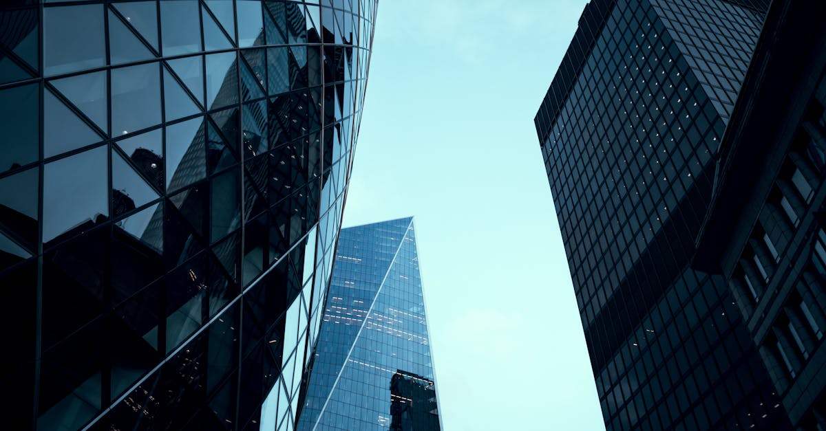 Dramatic view of iconic skyscrapers in London's financial district, showcasing modern architecture.