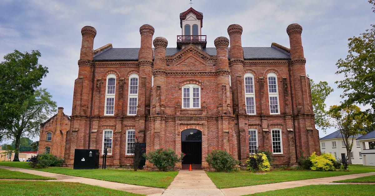 Front view of the historic Shelby County Courthouse in Texas, showcasing its unique architecture and brick exterior.