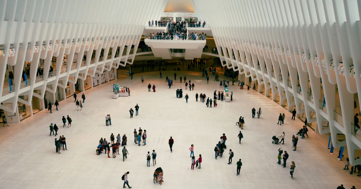 Crowds inside the modern Oculus Transportation Hub in Manhattan's World Trade Center.