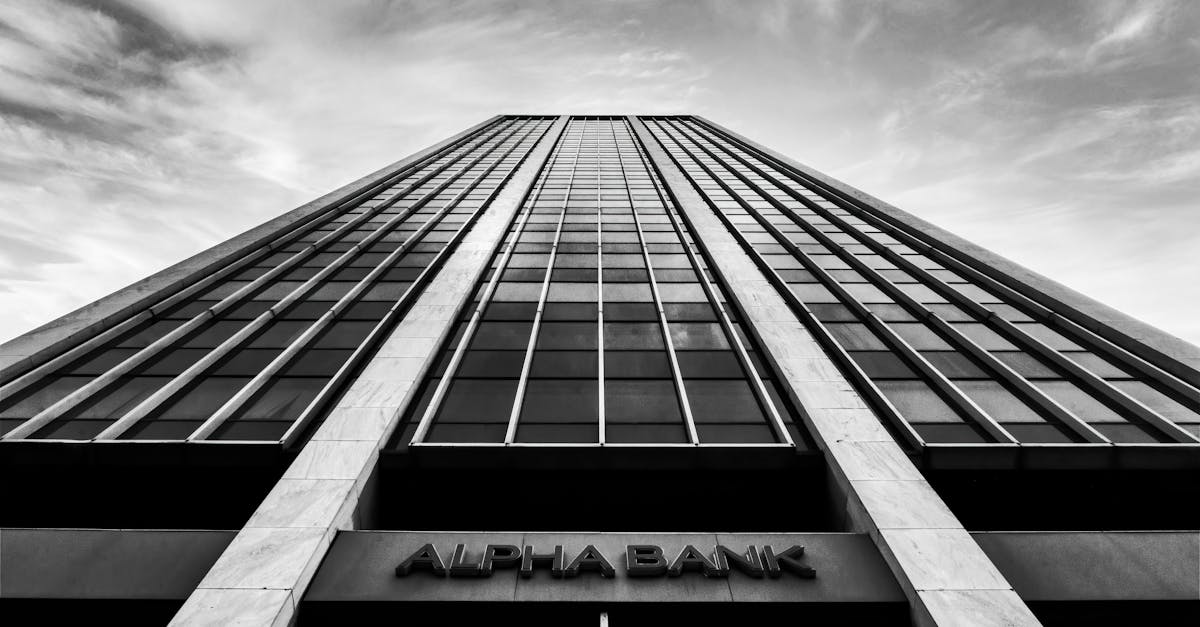 A striking black and white photo of a high-rise building in Athens, Greece.