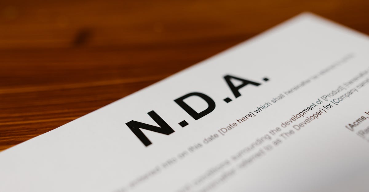 Focused close-up of an NDA document on a wooden desk, highlighting contract details.