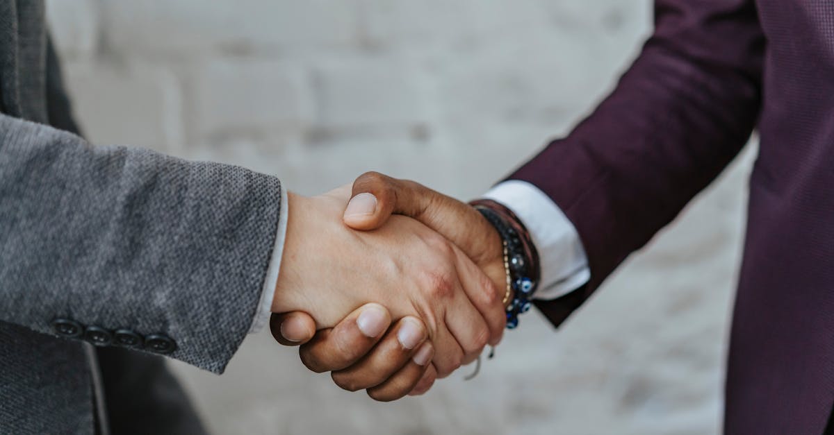 Professional handshake symbolizing cooperation and partnership in a business setting.