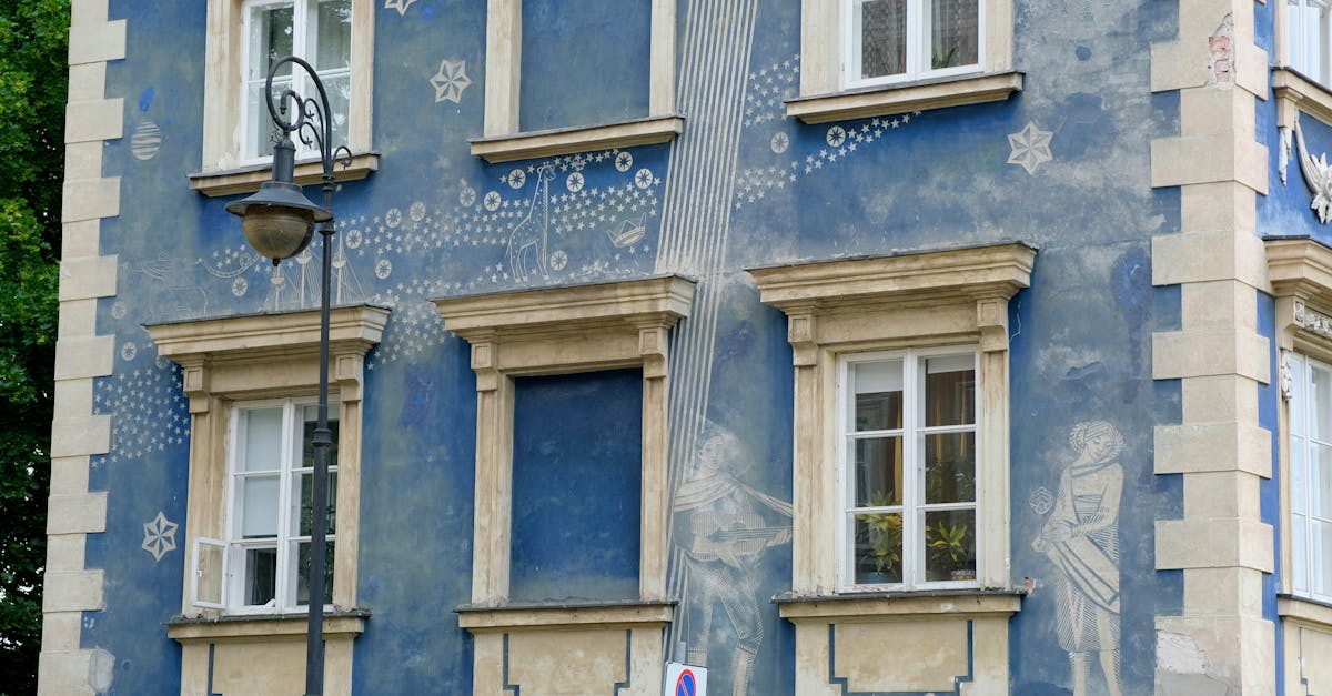 Colorful building facade with starry artwork and celestial motifs under daylight.