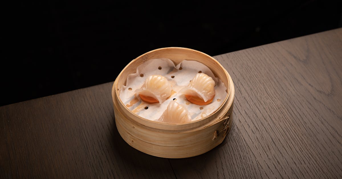 Tasty steamed dumplings in a bamboo steamer, perfect for an authentic dining experience.