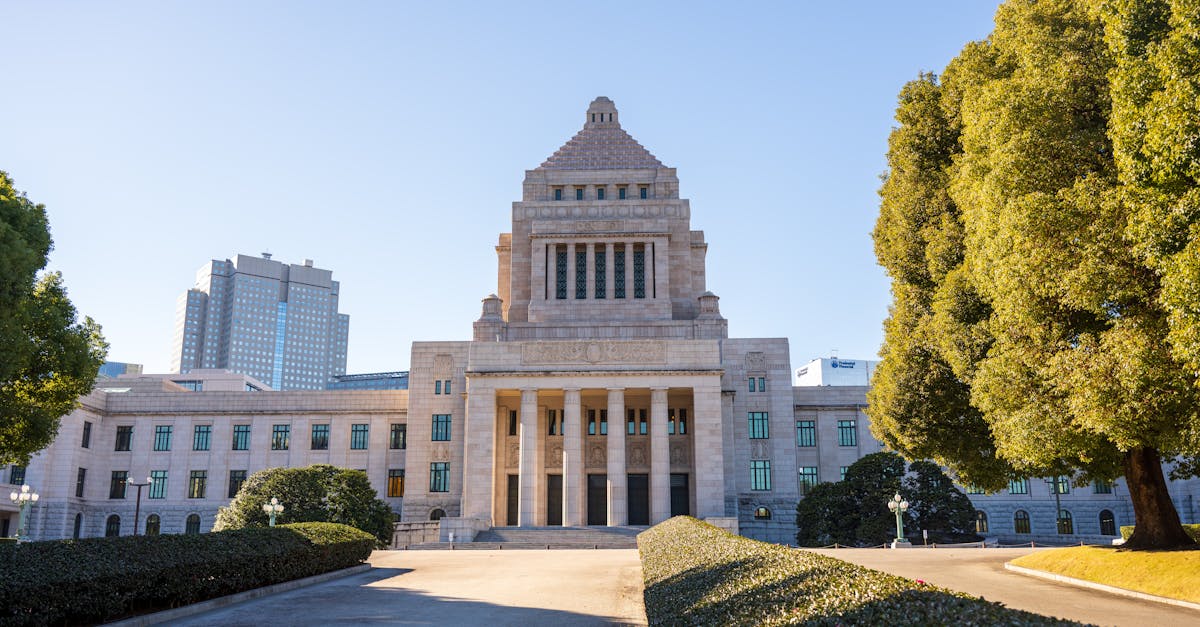 Front view of the National Diet Building in Tokyo on a sunny day, showcasing classic architecture.