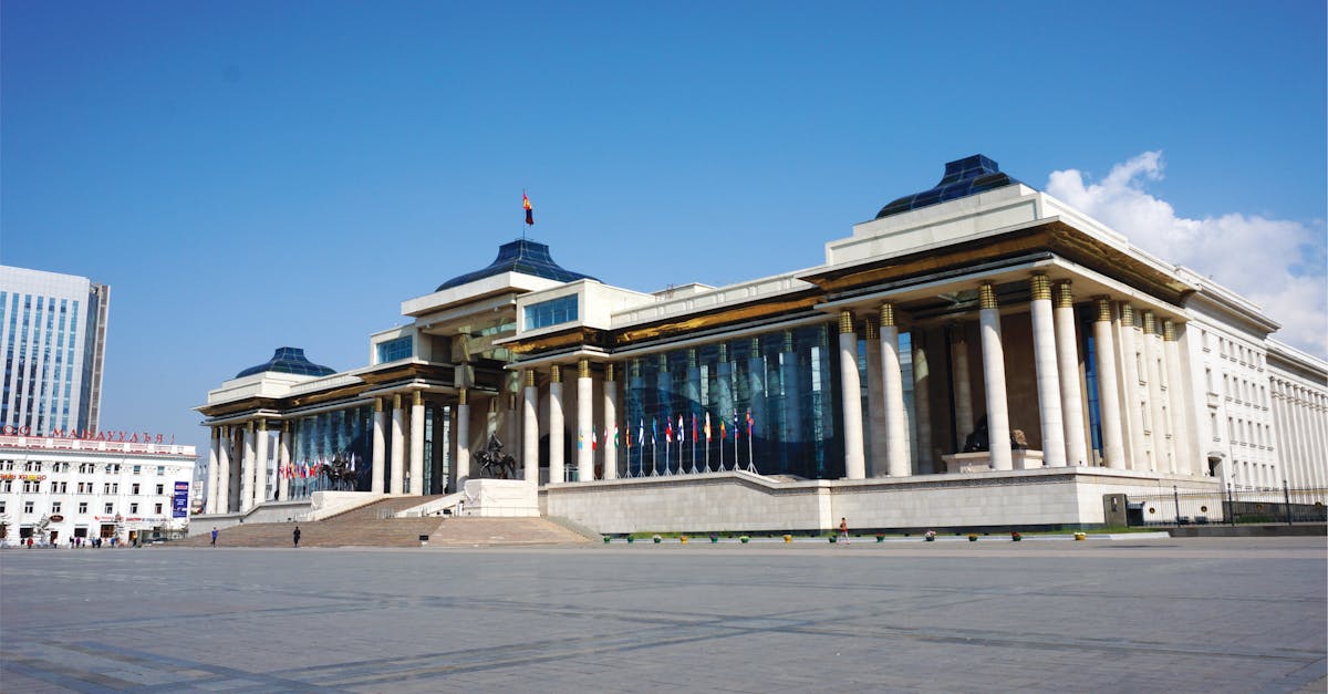 The Mongolian Government Palace in Sukhbaatar Square under a clear blue sky.