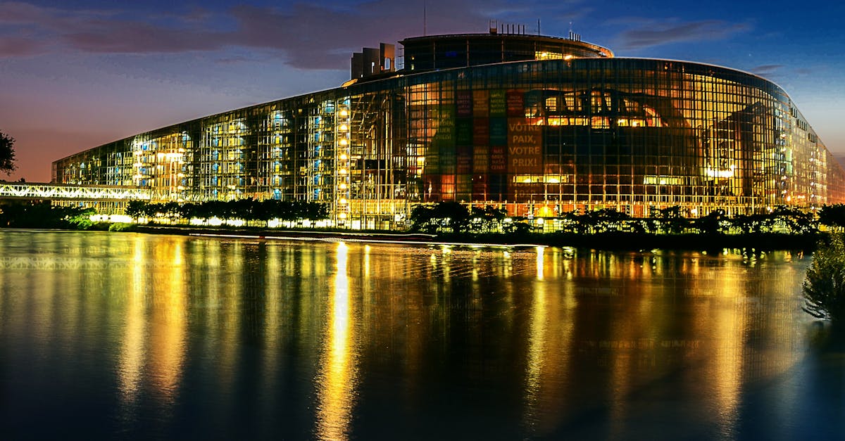 Stunning night view of the European Parliament in Strasbourg, beautifully reflected in the water.