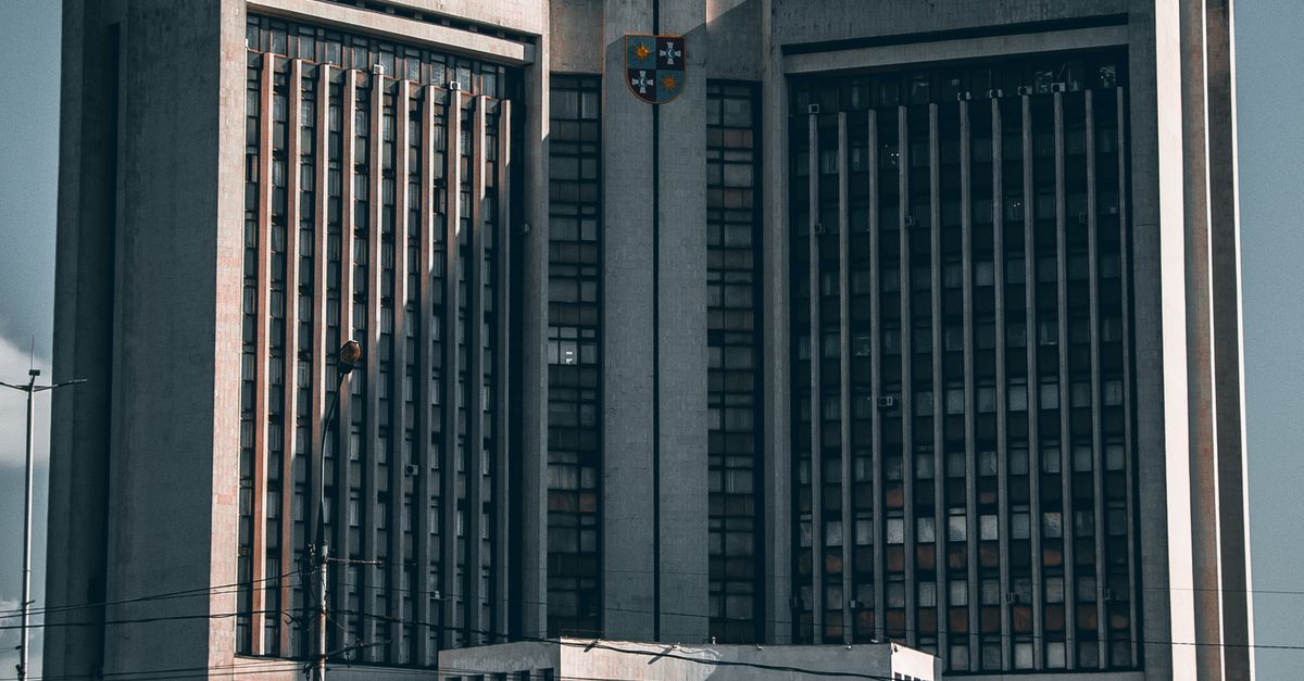 Front view of a striking government building in Ukraine under a clear sky.