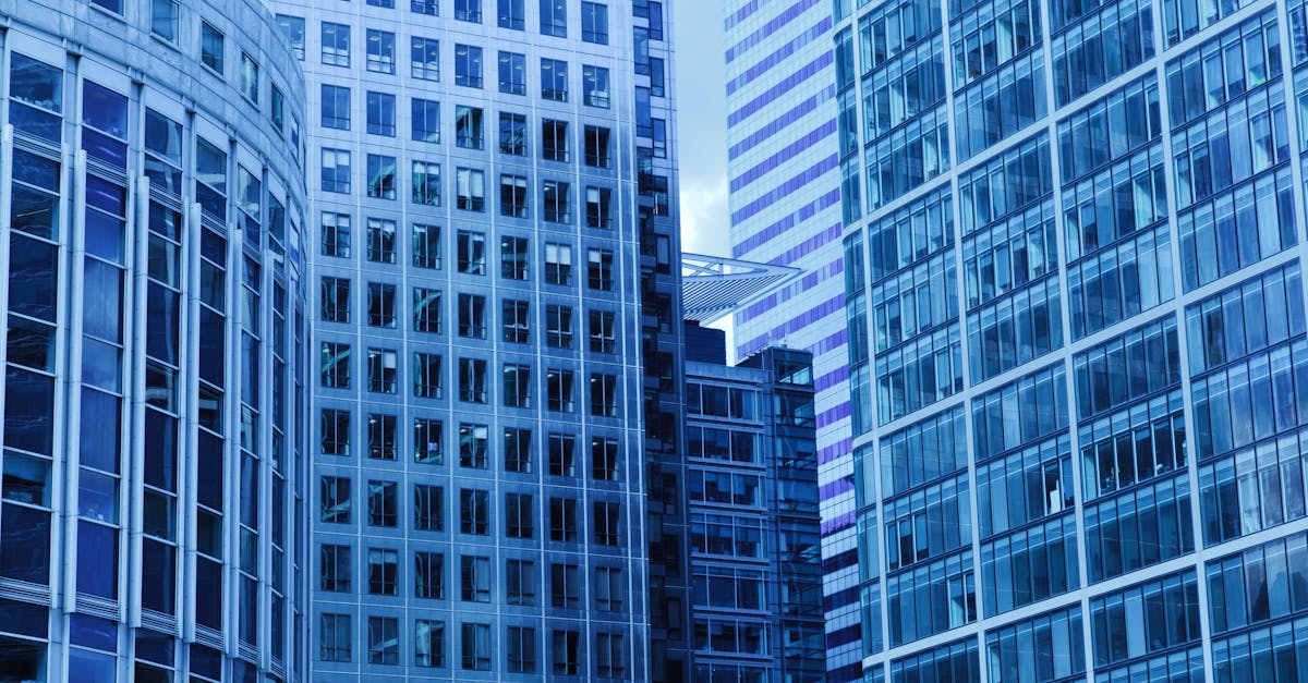 A close-up view of modern skyscrapers with glass facades in a cityscape.