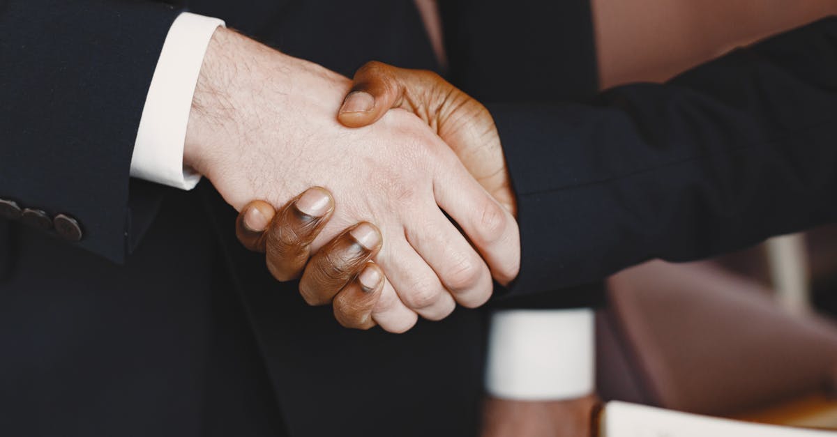 Close-up of a professional handshake symbolizing partnership and agreement.