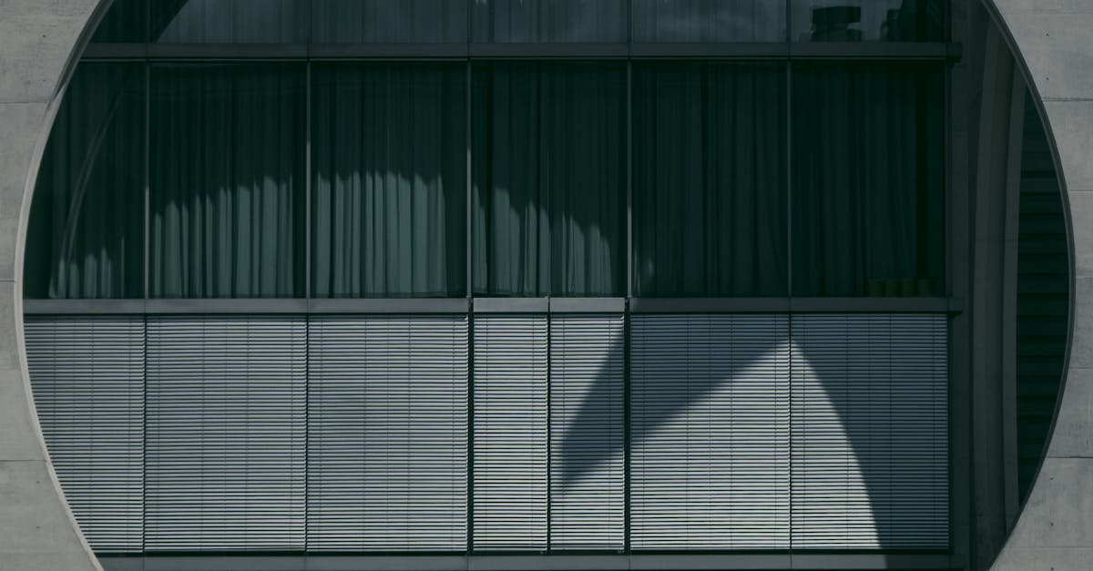 Man walking by the circular facade of Marie-Elisabeth-Luders House in Berlin.