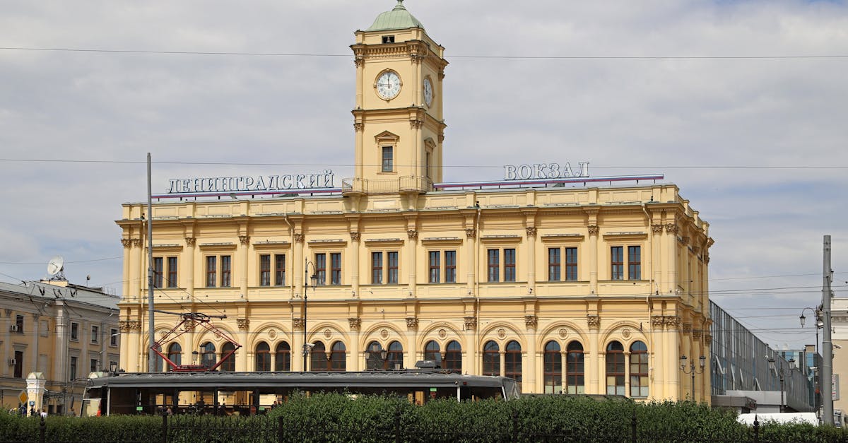 Historic Leningradsky Railway Station in Moscow with iconic clock tower.