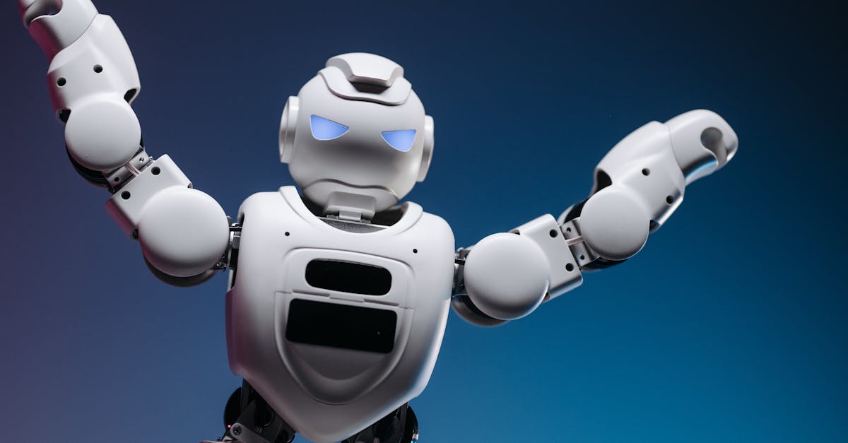 A futuristic robot in a studio setting, striking a powerful pose with raised arms.