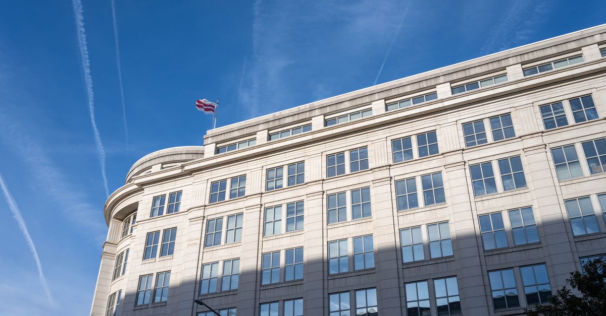 Elegant office building under a clear blue sky in Washington, D.C.