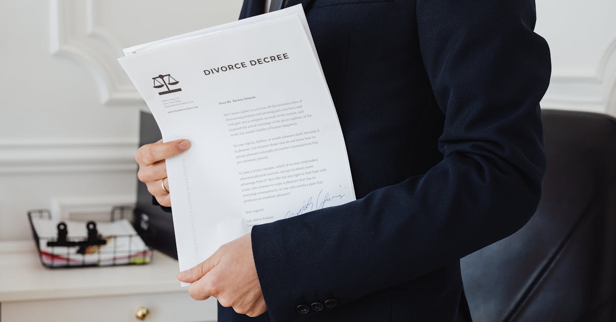A person holding a divorce decree in an office setting, symbolizing legal proceedings.