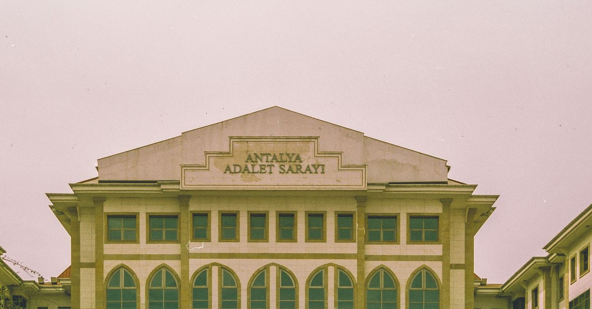 Front view of Antalya Courthouse showcasing its Gothic windows and classical architecture in Antalya, Turkey.