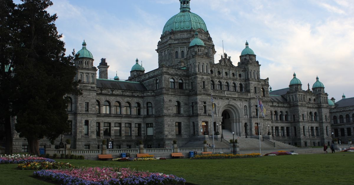 Explore the majestic architecture of the Victoria BC Parliament Building surrounded by lush gardens.