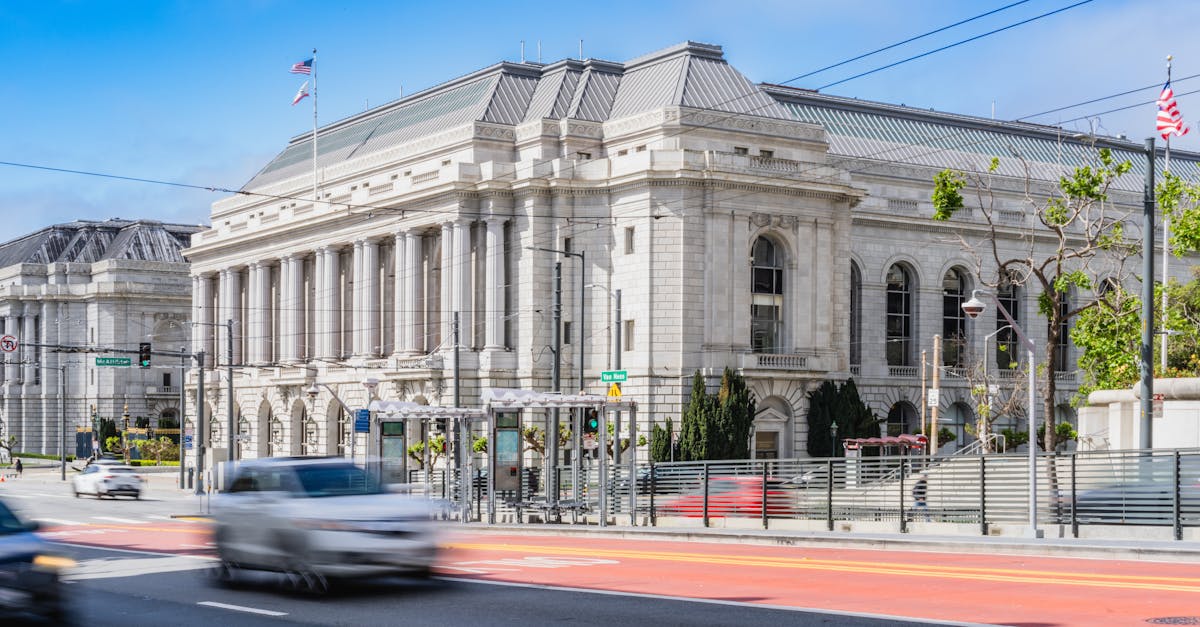 Elegant historic architecture photographed in San Francisco's Civic Center, capturing urban movement.