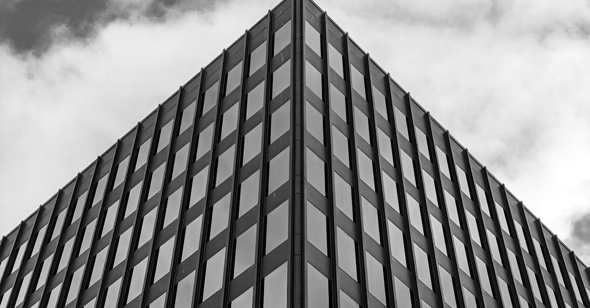 Black and white photo of a geometric, modern office building in Halifax, NS, showcasing urban architecture.