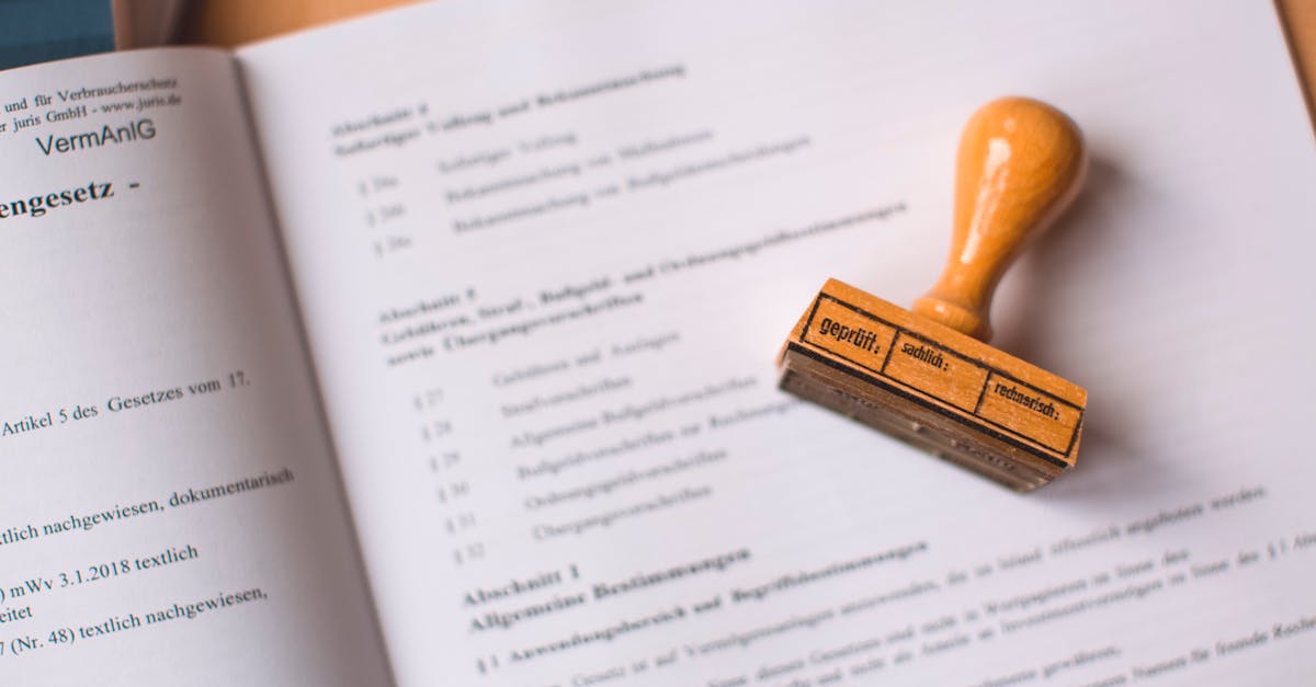 Close-up of a legal document with a wooden stamp placed on top, highlighting verification.