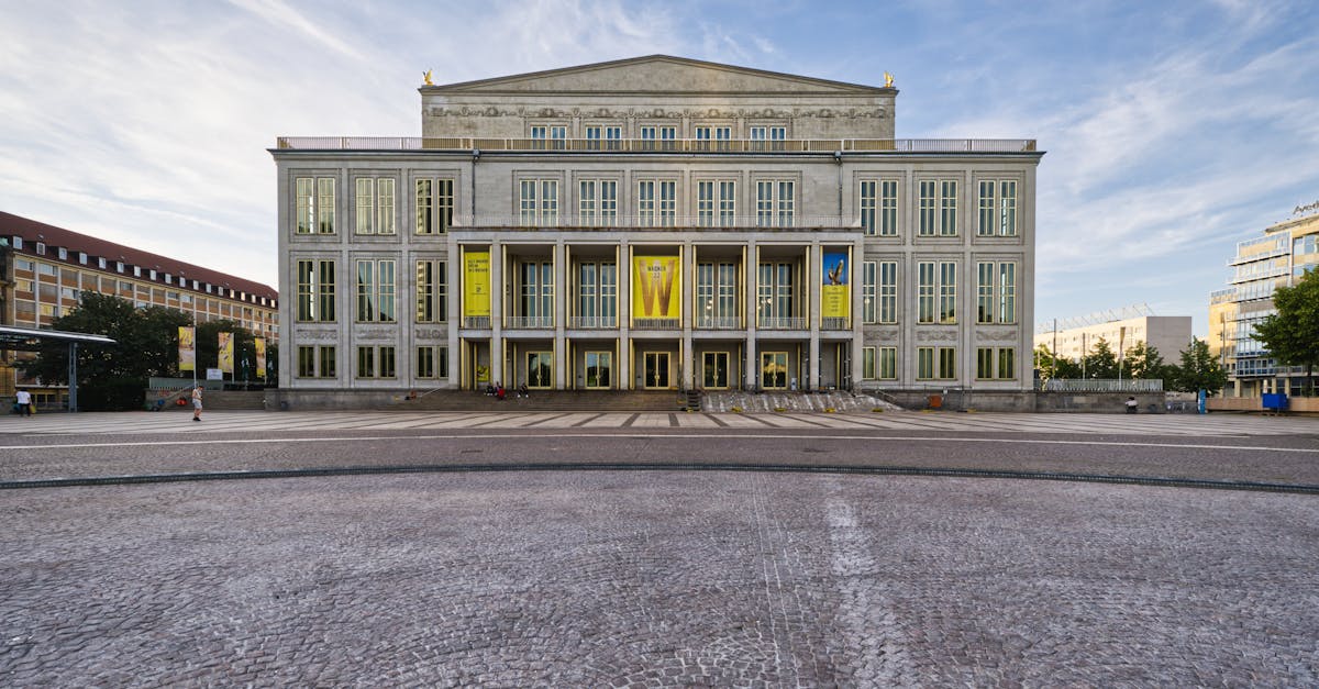 Front view of the iconic Leipzig Opera House with its neoclassical design in the daylight.