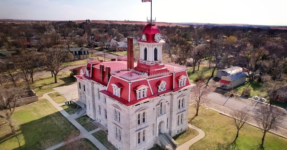 Aerial shot of the historic Chase County Courthouse in Cottonwood Falls, KS, capturing its distinctive architecture.