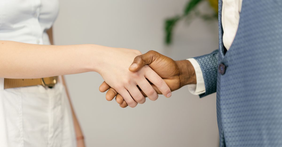 Close-up of a professional handshake symbolizing agreement and partnership in business.
