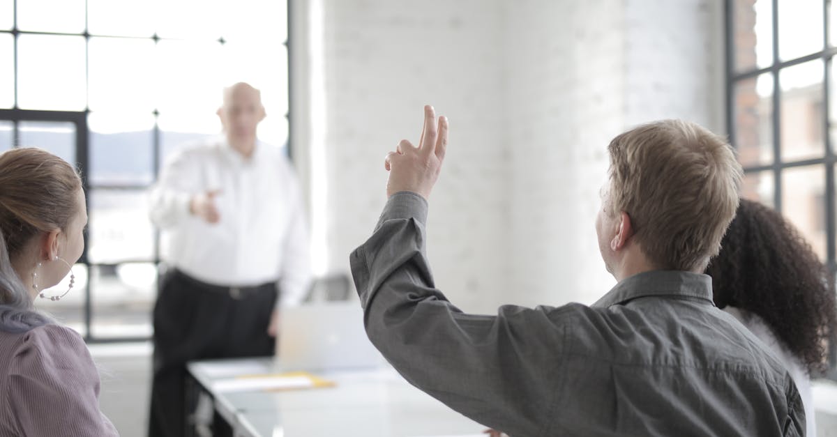Colleagues engaged in a brainstorming session in a modern office setting.