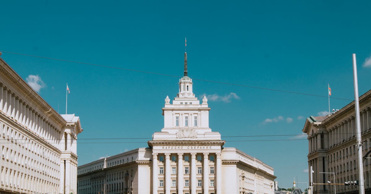 The National Assembly Building in Sofia, Bulgaria under a clear blue sky.