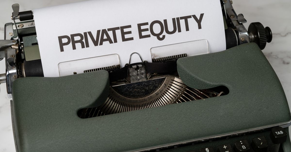 Close-up of vintage typewriter with 'PRIVATE EQUITY' on paper, business concept.