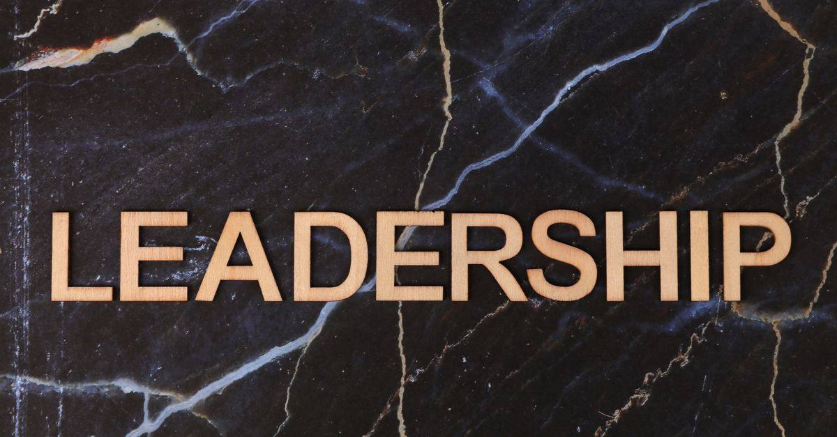 Leadership text on a striking dark marble surface, symbolizing strength.