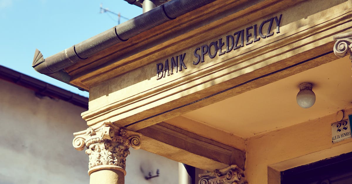 Detailed view of a historic Polish bank facade with classic architectural columns.