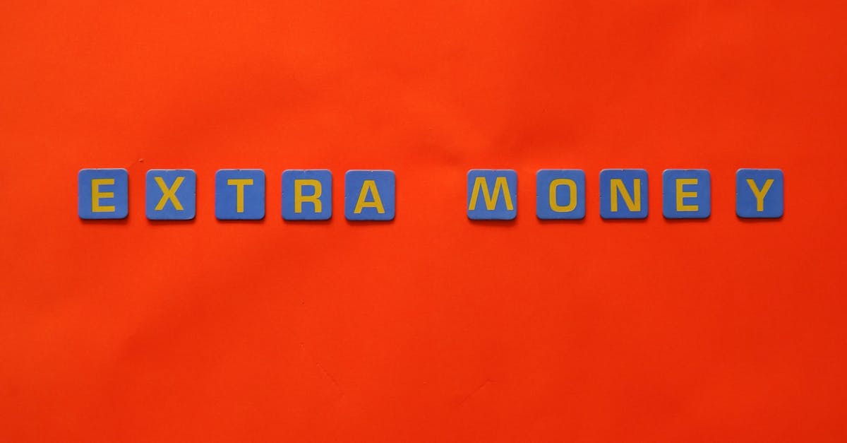 Bright orange background with 'EXTRA MONEY' spelled in blue and yellow tiles, illustrating financial concepts.