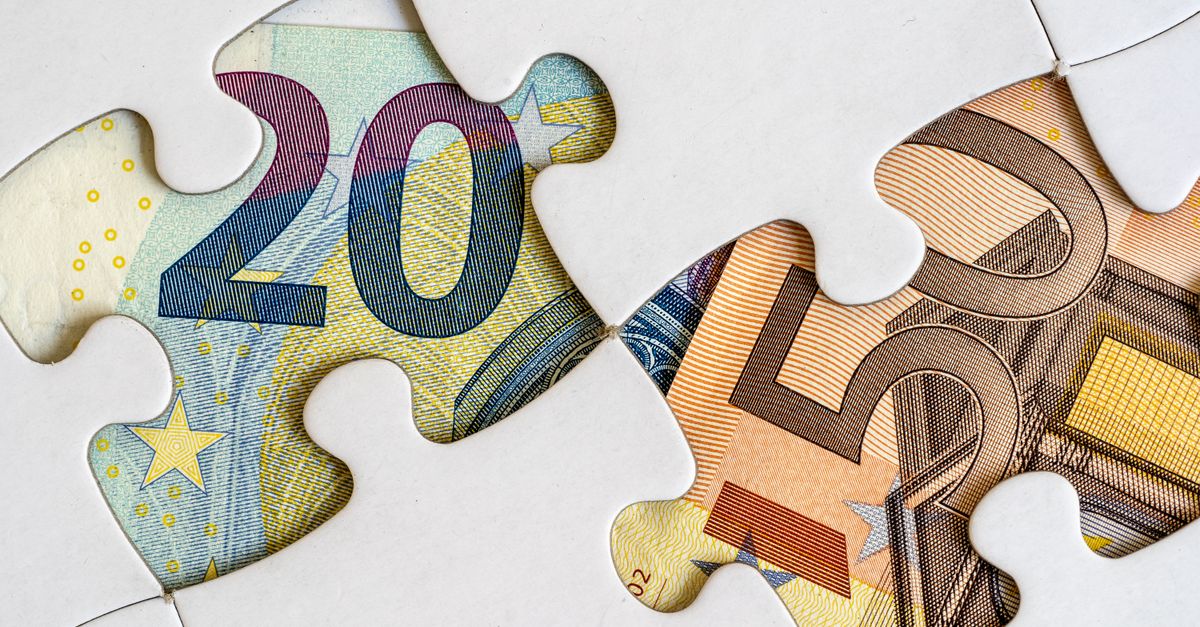 Euro banknotes creatively displayed within a jigsaw puzzle theme.