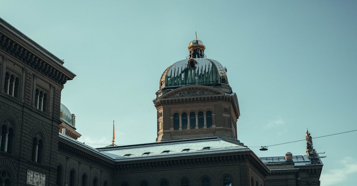 The Swiss Parliament Building in Bern showcased under a clear winter sky.