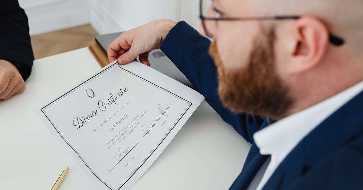 A man holding a divorce certificate in a formal office environment.