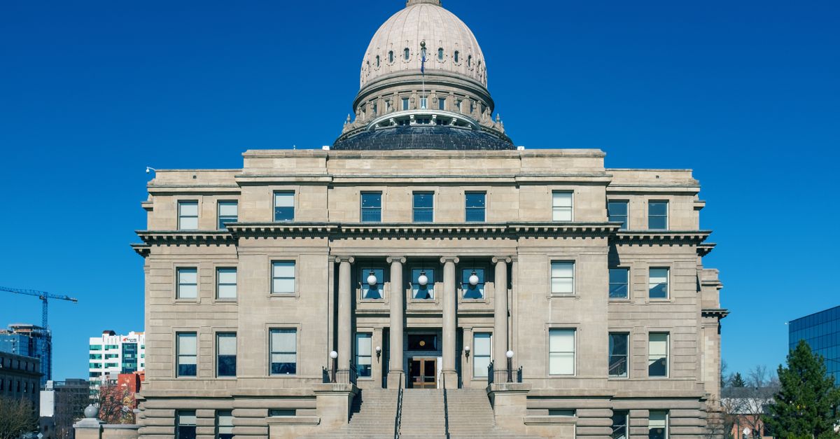 Front view of the historic Idaho State Capitol Building under blue skies in Boise.