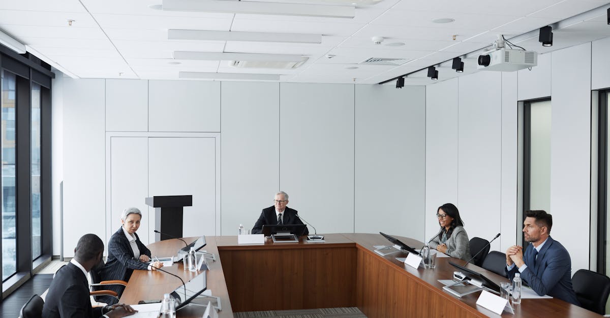 Multicultural business team in a conference room discussing strategies.