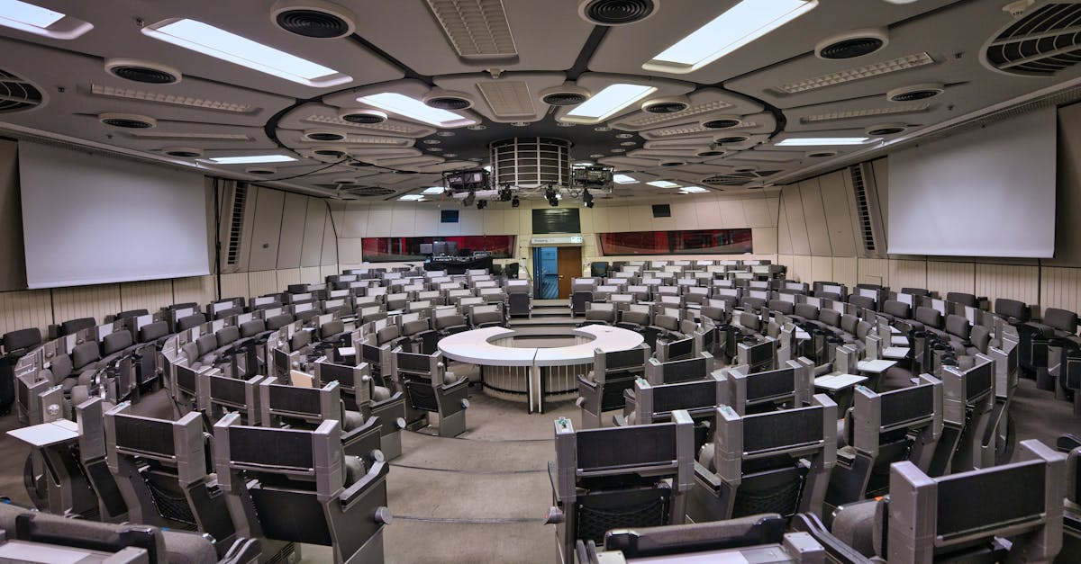 Empty futuristic conference room in Berlin ICC with circular seating and high-tech design.