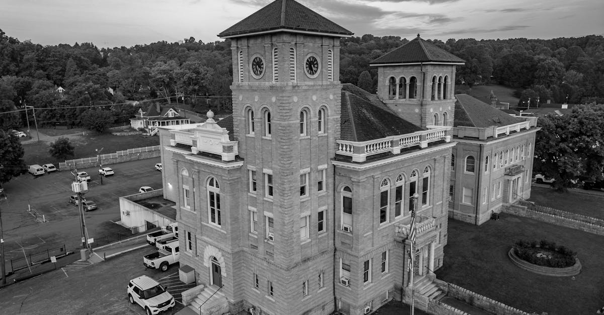 A stunning aerial view of a historic courthouse in black and white, showcasing classic architecture.